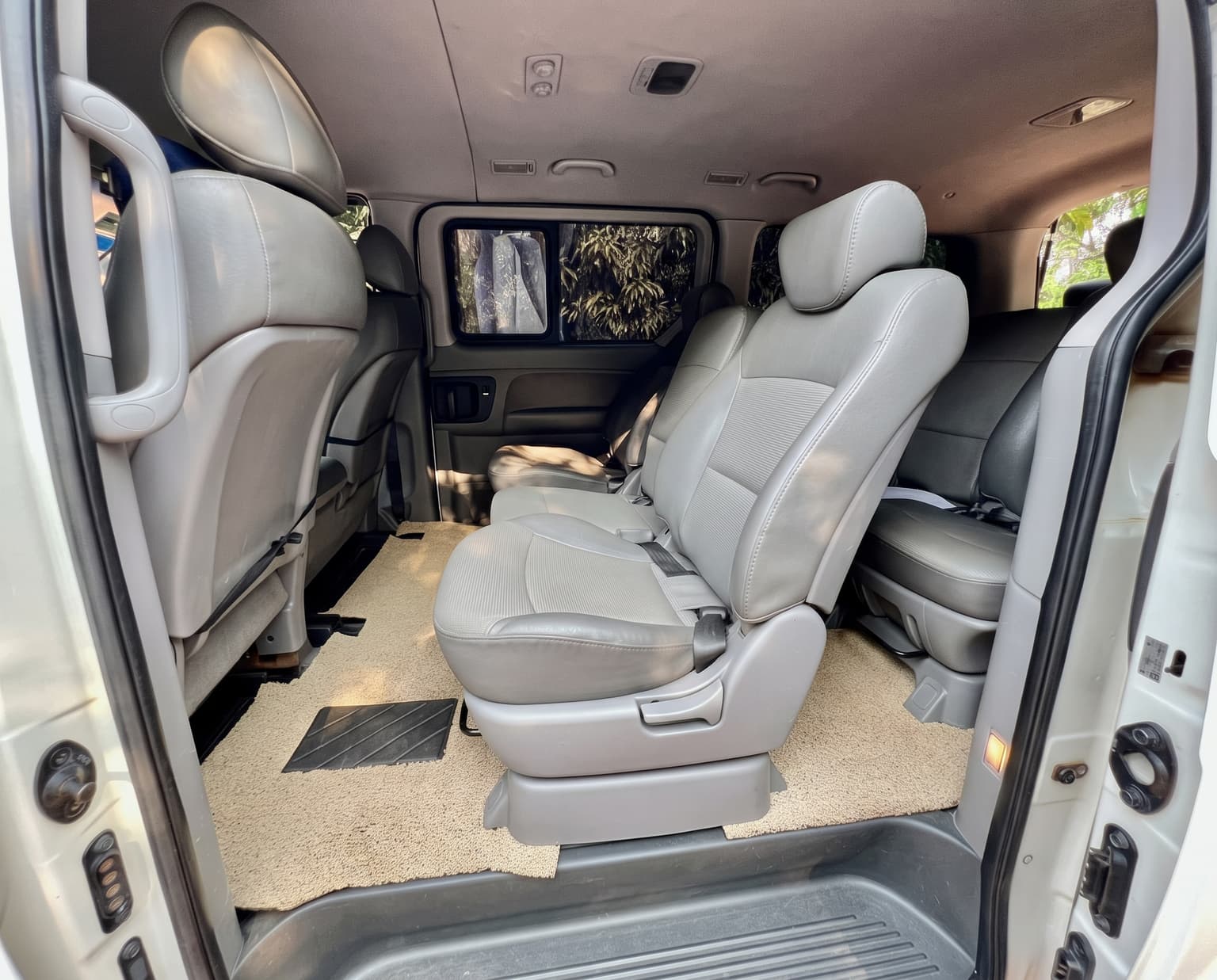 Spacious grey leather VIP seats and legroom inside the SafeRoam Express Hyundai Starex